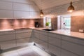 Modern kitchenette with white worktop in industrial style