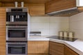 Modern kitchenette with wooden furniture