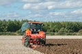 Modern Kubota tractor pulling a plough Royalty Free Stock Photo