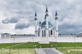 Modern Kul-Sharif mosque behind white stone wall of ancient Kazan Kremlin, Russia Royalty Free Stock Photo