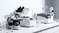 Modern Laboratory Equipment Microscope, Centrifuge, and Analyzers on a Clean Bench Royalty Free Stock Photo
