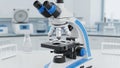 Modern laboratory microscope on table with test tubes in background Royalty Free Stock Photo