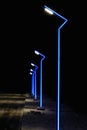 Modern lamppost with blue illumination. Street light. A modern looking street lamp post