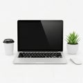 Modern laptop with coffee cup and plant isolated on white background isolated on white background Royalty Free Stock Photo
