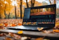 Modern laptop computer resting on a wooden ground adorned with fallen leaves, AI-generated.