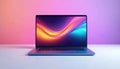 Modern laptop device against colorful gradient background. Computer with vibrant display screen on table. Tech illustration Royalty Free Stock Photo