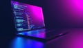 Modern laptop displaying computer code on screen in neon light Royalty Free Stock Photo