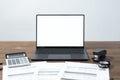 Modern laptop and documents on wooden table Royalty Free Stock Photo