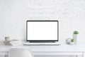 Modern laptop with isolated screen for mockup on office desk Royalty Free Stock Photo