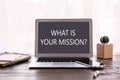 Modern laptop with question WHAT IS YOUR MISSION? on screen Royalty Free Stock Photo