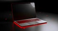 Modern Laptop with Red Backlight on Dark Background Royalty Free Stock Photo