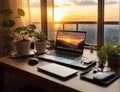 Modern laptop with screen on table against blurred sunset background, stunning view Royalty Free Stock Photo