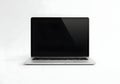 Modern laptop with sleek design on a clean surface isolated on white background Royalty Free Stock Photo
