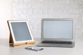 Modern laptop, tablet and smartphone on table indoors. Space for design Royalty Free Stock Photo