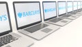 Modern laptops with Barclays logo. Computer technology conceptual editorial 4K clip, seamless loop