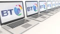 Modern laptops with BT Group logo. Computer technology conceptual editorial 3D rendering