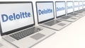 Modern laptops with Deloitte logo. Computer technology conceptual editorial 3D rendering Royalty Free Stock Photo