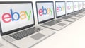 Modern laptops with eBay Inc. logo. Computer technology conceptual editorial 3D rendering