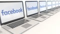 Modern laptops with Facebook logo. Computer technology conceptual editorial 3D rendering