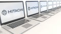 Modern laptops with Hitachi logo. Computer technology conceptual editorial 3D rendering