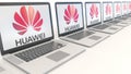 Modern laptops with Huawei logo. Computer technology conceptual editorial 3D rendering Royalty Free Stock Photo