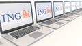 Modern laptops with ING Group logo. Computer technology conceptual editorial 3D rendering