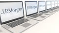 Modern laptops with J.P. Morgan logo. Computer technology conceptual editorial 3D rendering