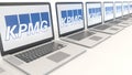 Modern laptops with KPMG logo. Computer technology conceptual editorial 3D rendering