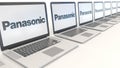 Modern laptops with Panasonic Corporation logo. Computer technology conceptual editorial 3D rendering