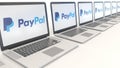 Modern laptops with PayPal logo. Computer technology conceptual editorial 3D rendering