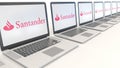 Modern laptops with Santander Serfin logo. Computer technology conceptual editorial 3D rendering