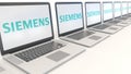 Modern laptops with Siemens logo. Computer technology conceptual editorial 3D rendering