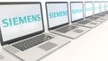 Modern laptops with Siemens logo. Computer technology conceptual editorial 3D rendering Royalty Free Stock Photo