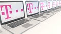 Modern laptops with T-Mobile logo. Computer technology conceptual editorial 3D rendering