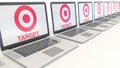 Modern laptops with Target Corporation logo. Computer technology conceptual editorial 3D rendering