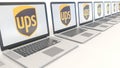 Modern laptops with United Parcel Service UPS logo. Computer technology conceptual editorial 3D rendering