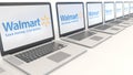 Modern laptops with Walmart logo. Computer technology conceptual editorial 3D rendering