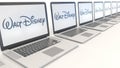 Modern laptops with Walt Disney Pictures logo. Computer technology conceptual editorial 3D rendering