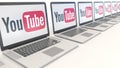Modern laptops with YouTube logo. Computer technology conceptual editorial 3D rendering