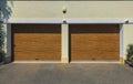 Modern, large automatic up and over garage door.