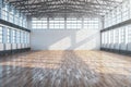 Modern large hangar interior with brick wall and wooden floor