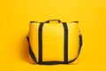 Modern large thermo bag on yellow background