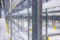 Modern large warehouse space interior, new and modern distribution storage with rows of empty high shelves and racks, concrete and Royalty Free Stock Photo
