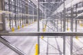 Modern large warehouse space interior, new and modern distribution storage with rows of empty high shelves and racks, concrete and Royalty Free Stock Photo