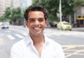 Modern latin guy with toothy smile in the city Royalty Free Stock Photo