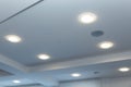 Modern layered ceiling with embedded lights and stretched ceiling inlay, lights on Royalty Free Stock Photo