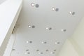 Modern layered ceiling with embedded lights and stretched ceiling inlay Royalty Free Stock Photo