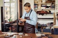 Modern Leatherworking Artisan In Shop