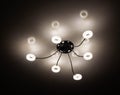 Modern LED chandelier on the ceiling of the house. Lighting with diodes, close-up Royalty Free Stock Photo