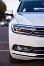 Modern LED headlight on a white car, close up Royalty Free Stock Photo